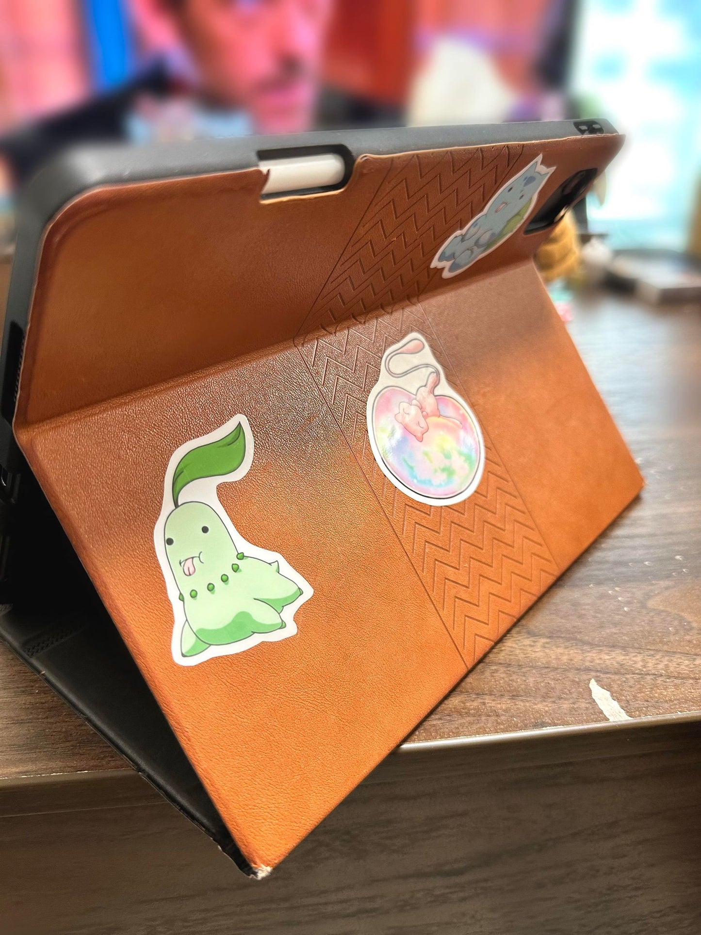 showing the stickers on an ipad case or the derpy pokemon stickers of bulbasaur, Chikorita, treecko, turtwig, snivy, chespin, grooky, rowlett, sprigatito