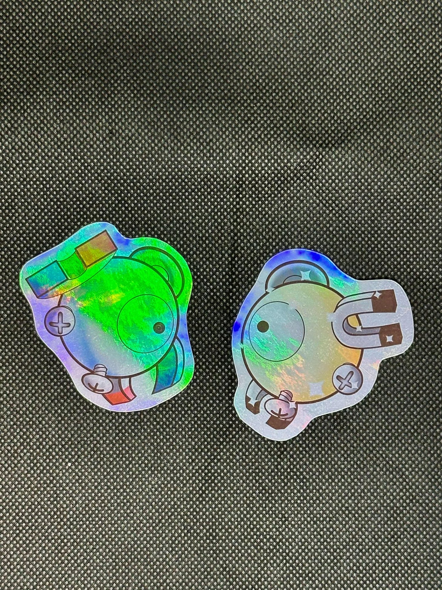 showing the stickers under different light and with a different background  for the pokemon magnemite sticker