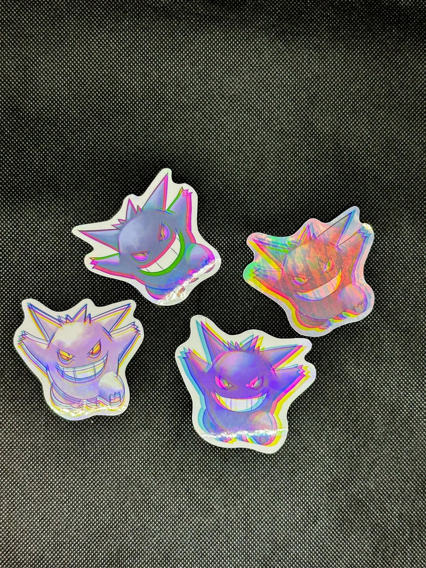 showing the variants with different backgrounds for the color shift pokemon gengar sticker