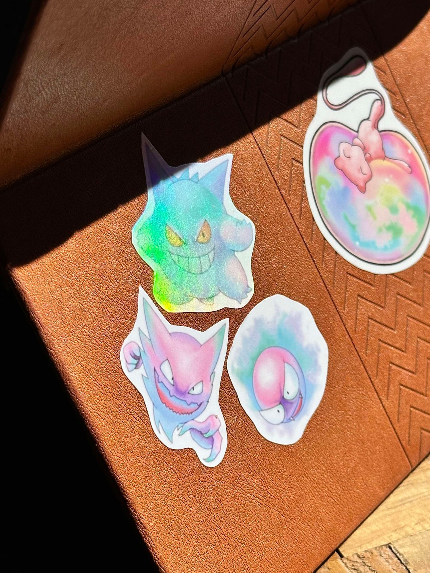 showing the stickers on my ipad case for the pastel pokemon gengar, haunter and gastly stickers