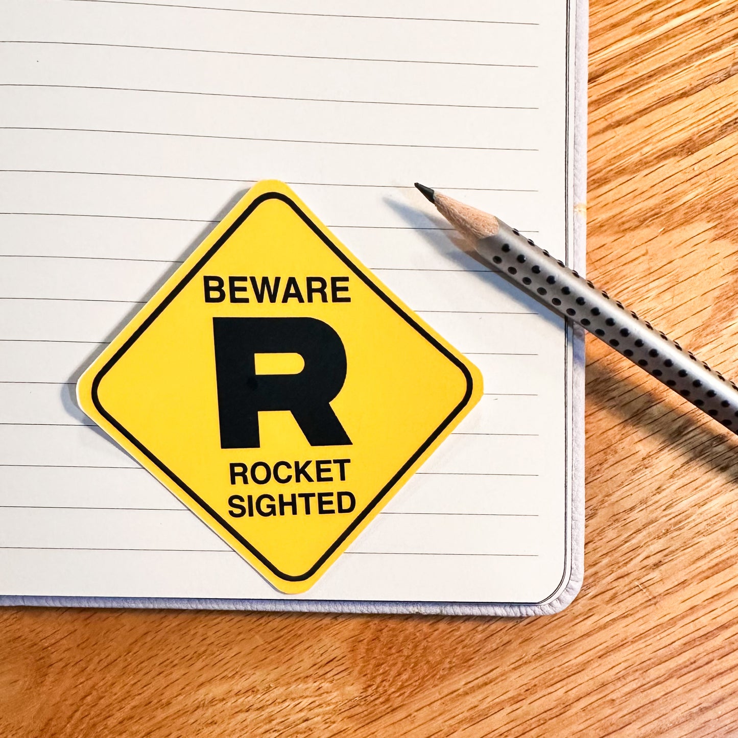 The pokemon team rocket sticker for the Pokemon sticker set of caution signs for Gyarados, snorlax, team rocket, spearow, kangaskhan, tall grass