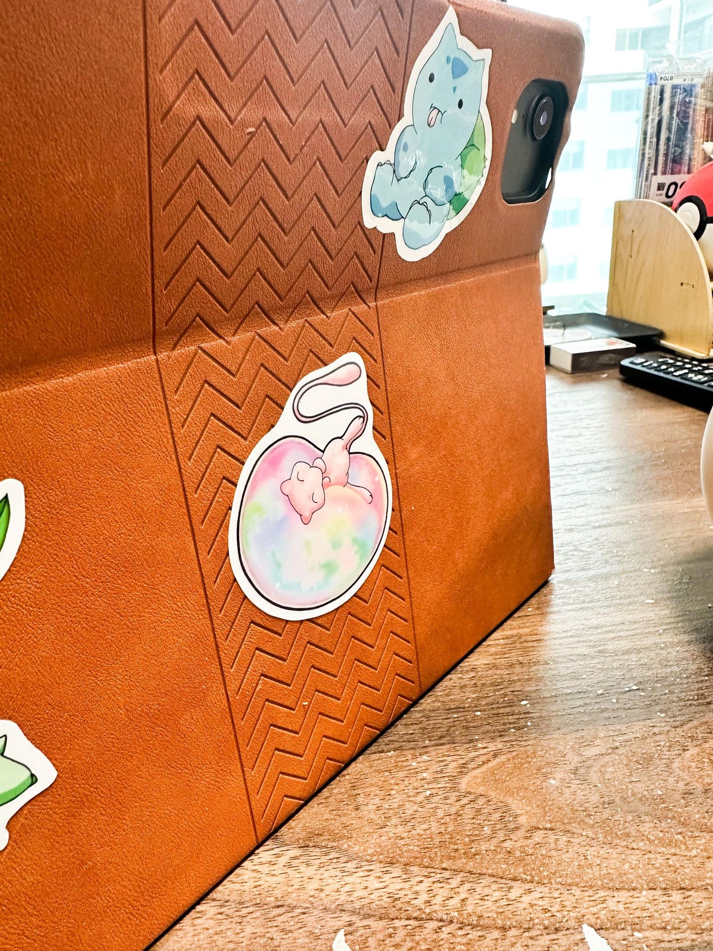 showing the sitckers on an ipad case for the pokemon mew sticker