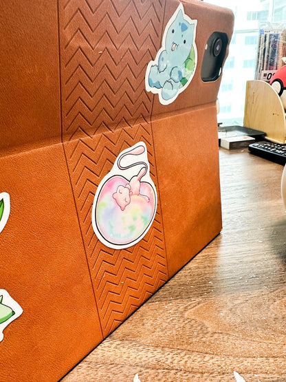 showing the sitckers on an ipad case for the pokemon mew sticker
