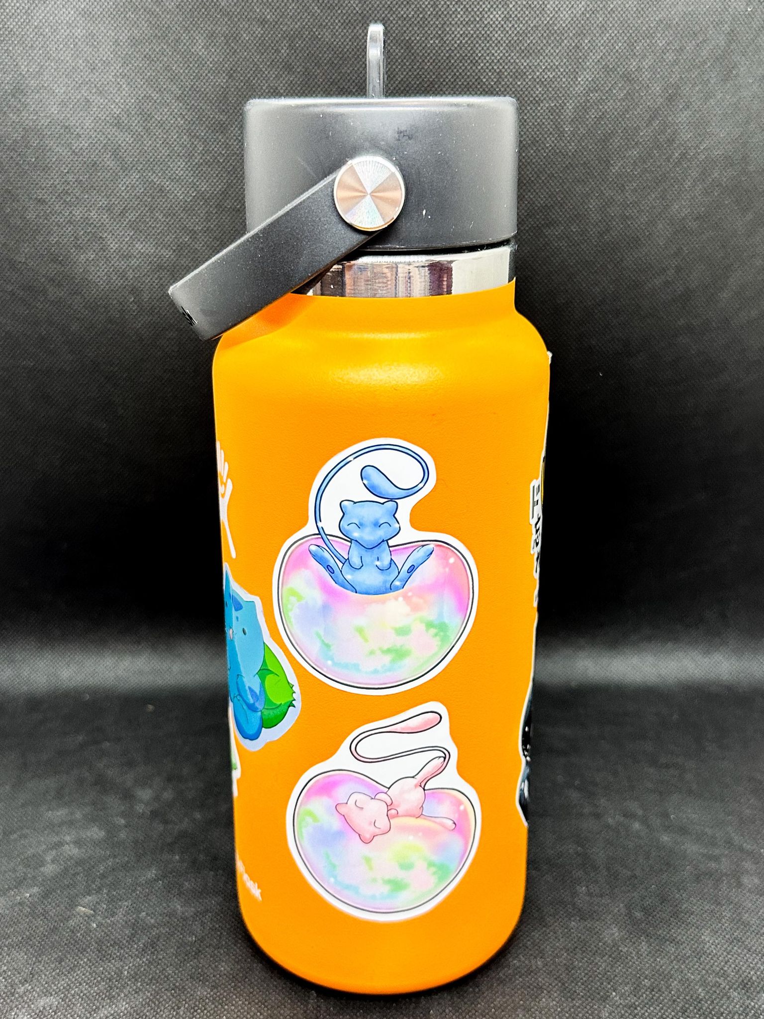 showing the stickers on a drink bottle for the pokemon mew sticker