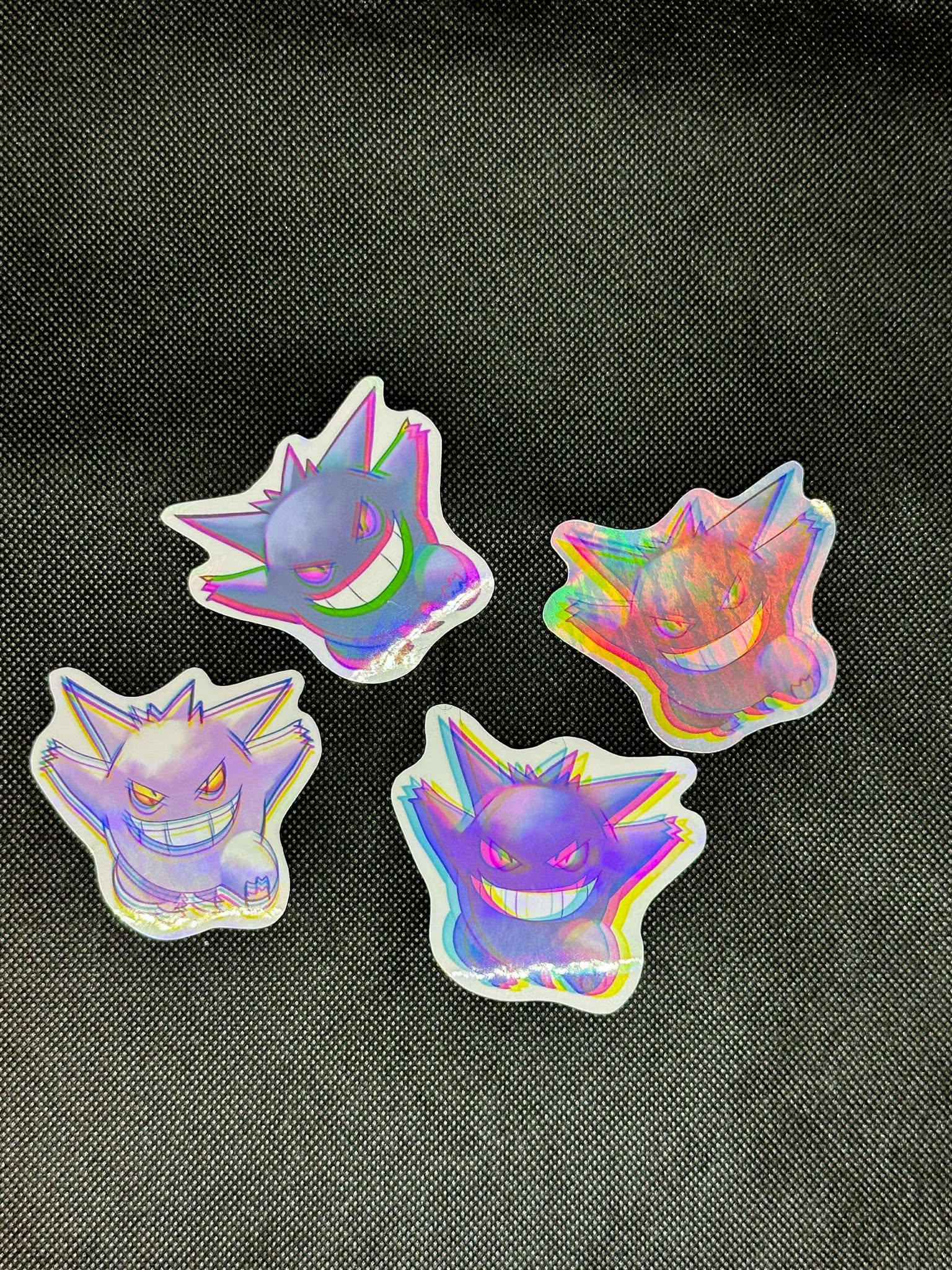 showing the variants with different backgrounds for the color shift pokemon gengar sticker