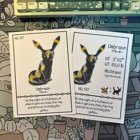 Both variants of the pokemon umbreon pokedex print in one photo