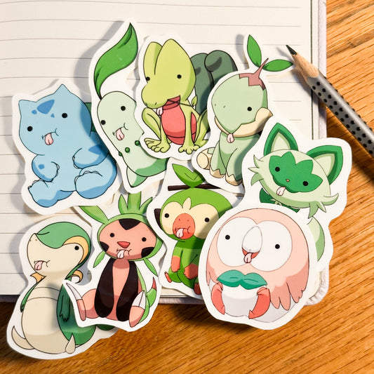 Showing the full set of 9 together for the derpy pokemon stickers of bulbasaur, Chikorita, treecko, turtwig, snivy, chespin, grooky, rowlett, sprigatito